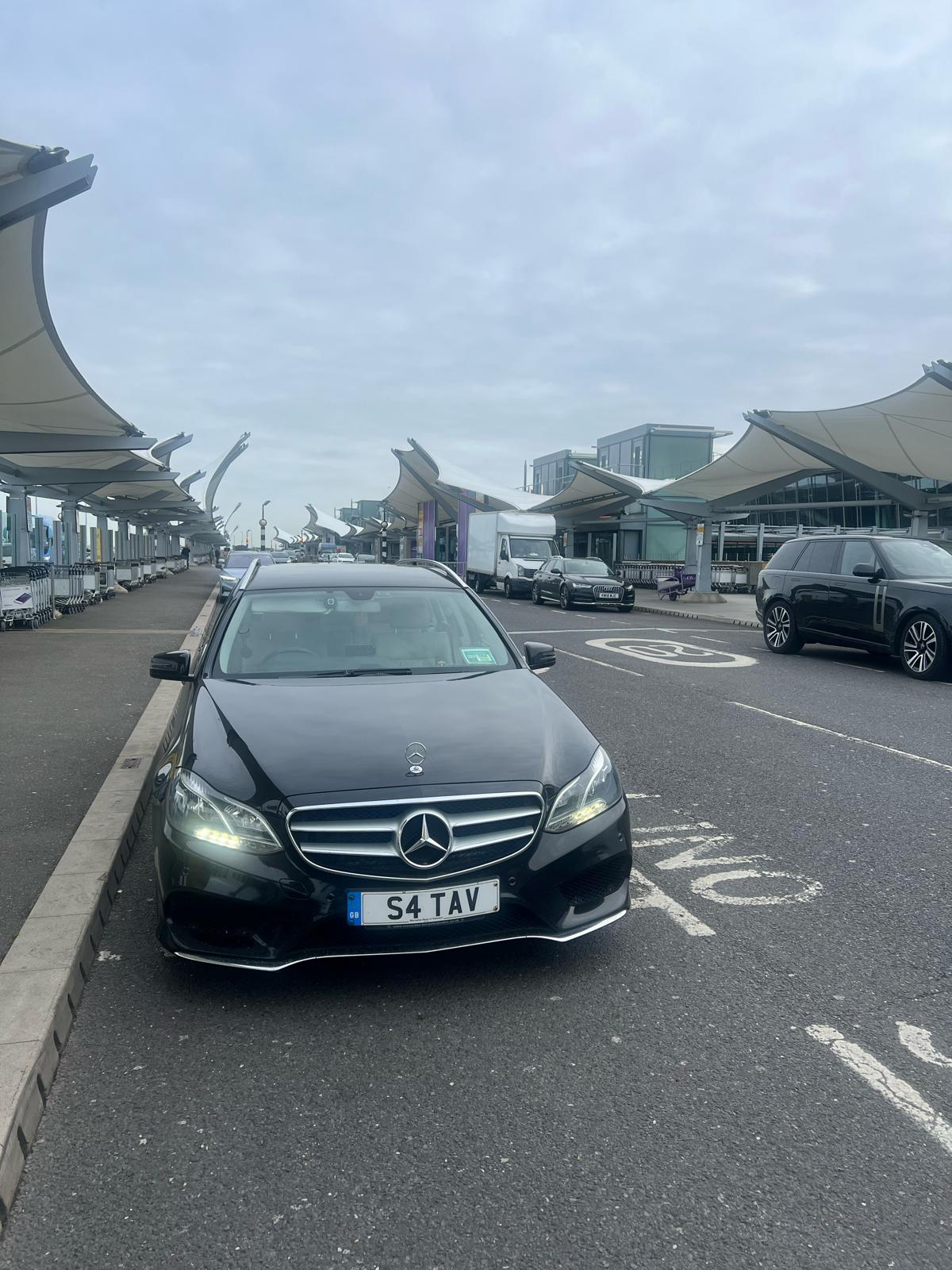 NABs Private Hire black Mercedes-Benz E-Class E350 arriving at Heathrow Terminal 5