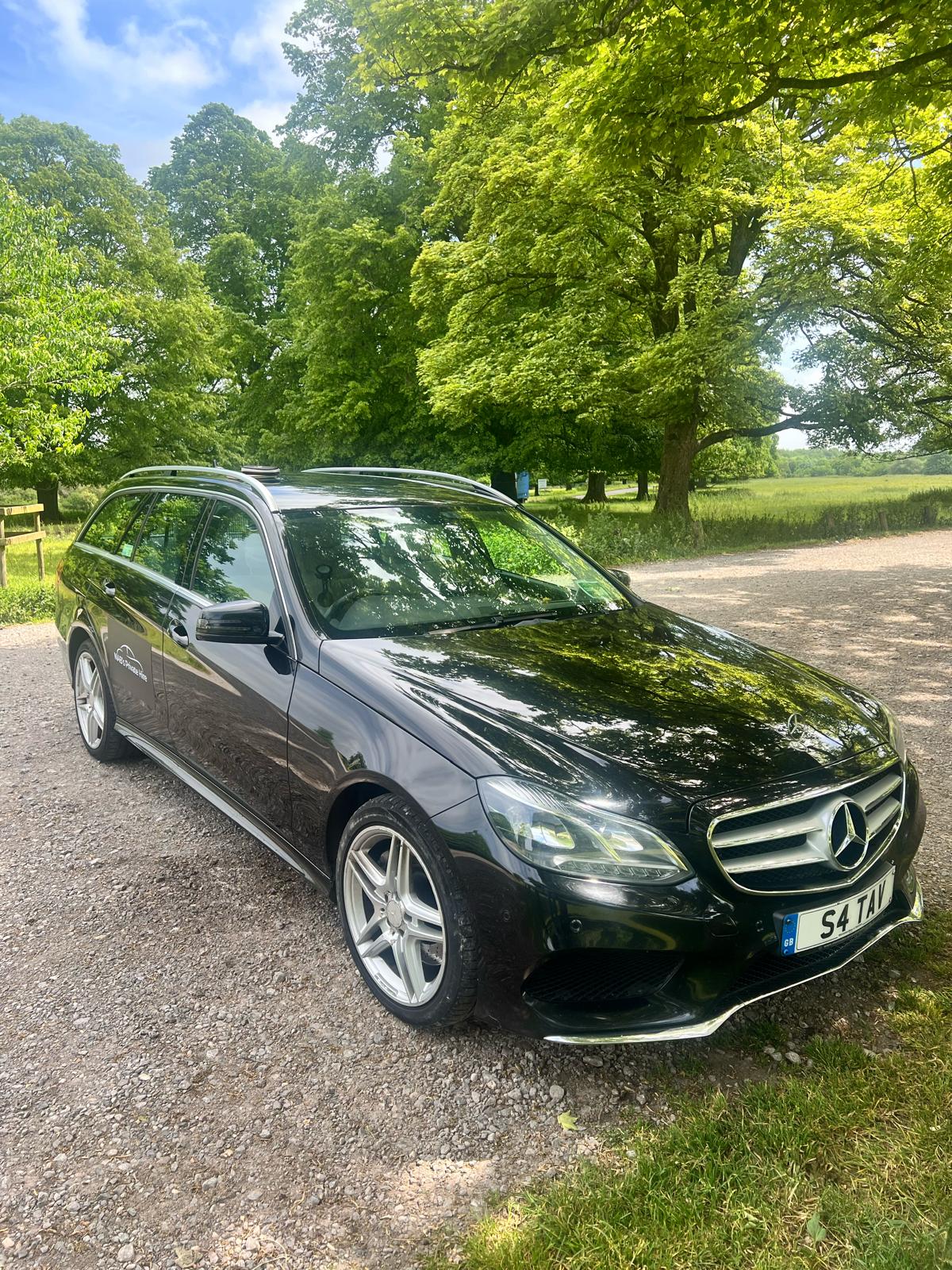NABs Private Hire signage on the black Mercedes-Benz E-Class E350 door panel